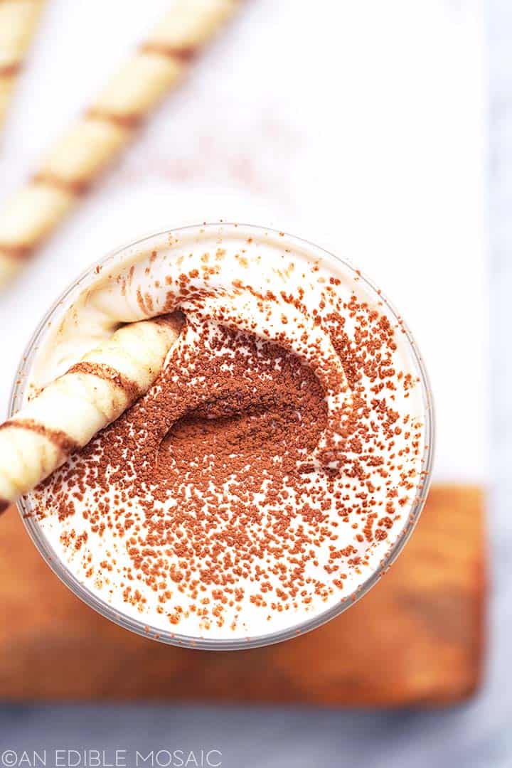 https://www.anediblemosaic.com/wp-content/uploads//2022/08/top-view-of-tiramisu-latte-with-piroutte-cookie.jpg