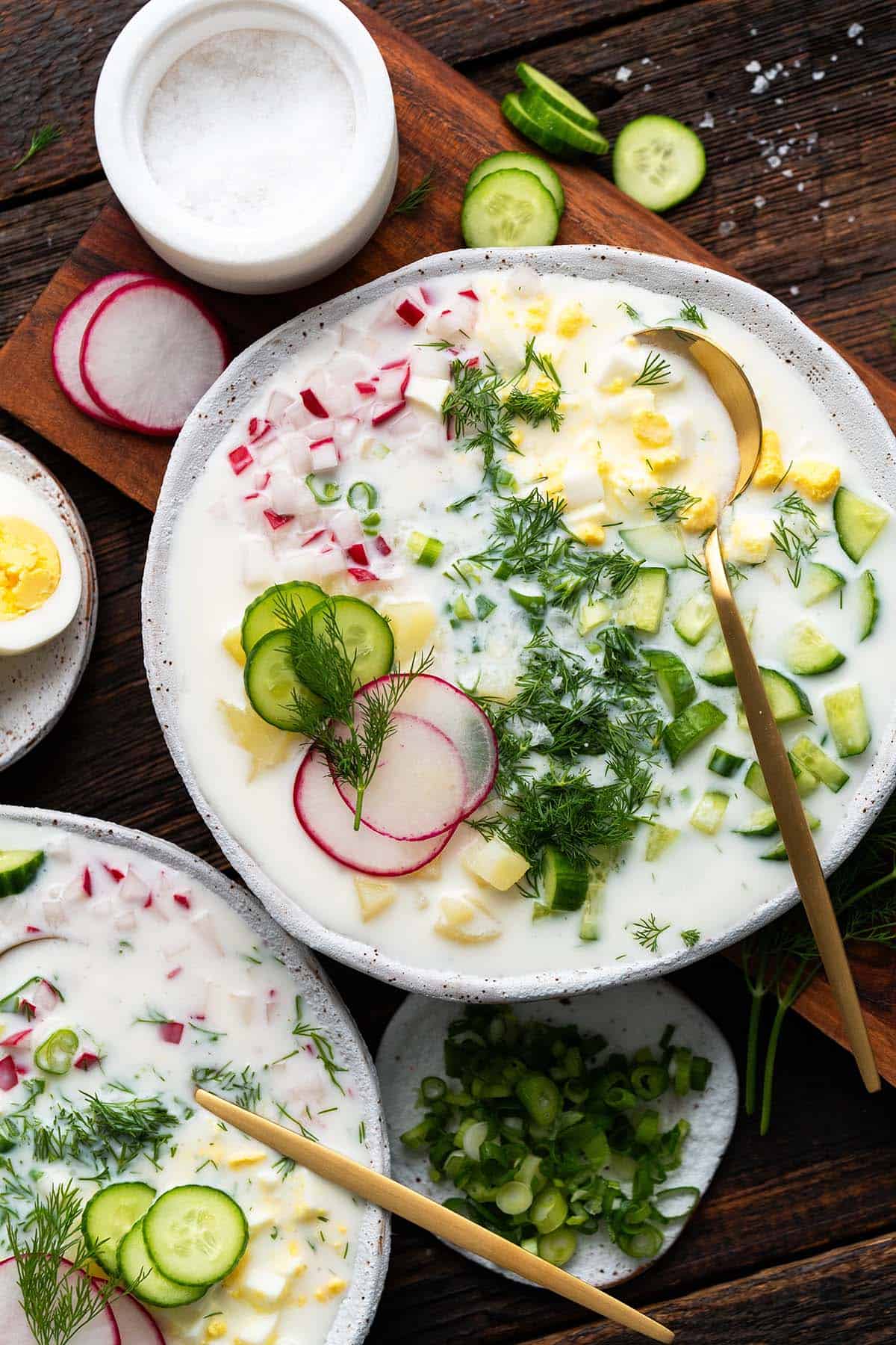 https://www.anediblemosaic.com/wp-content/uploads//2023/07/top-view-of-spread-of-okroshka-with-fresh-vegetables-and-kefir.jpg