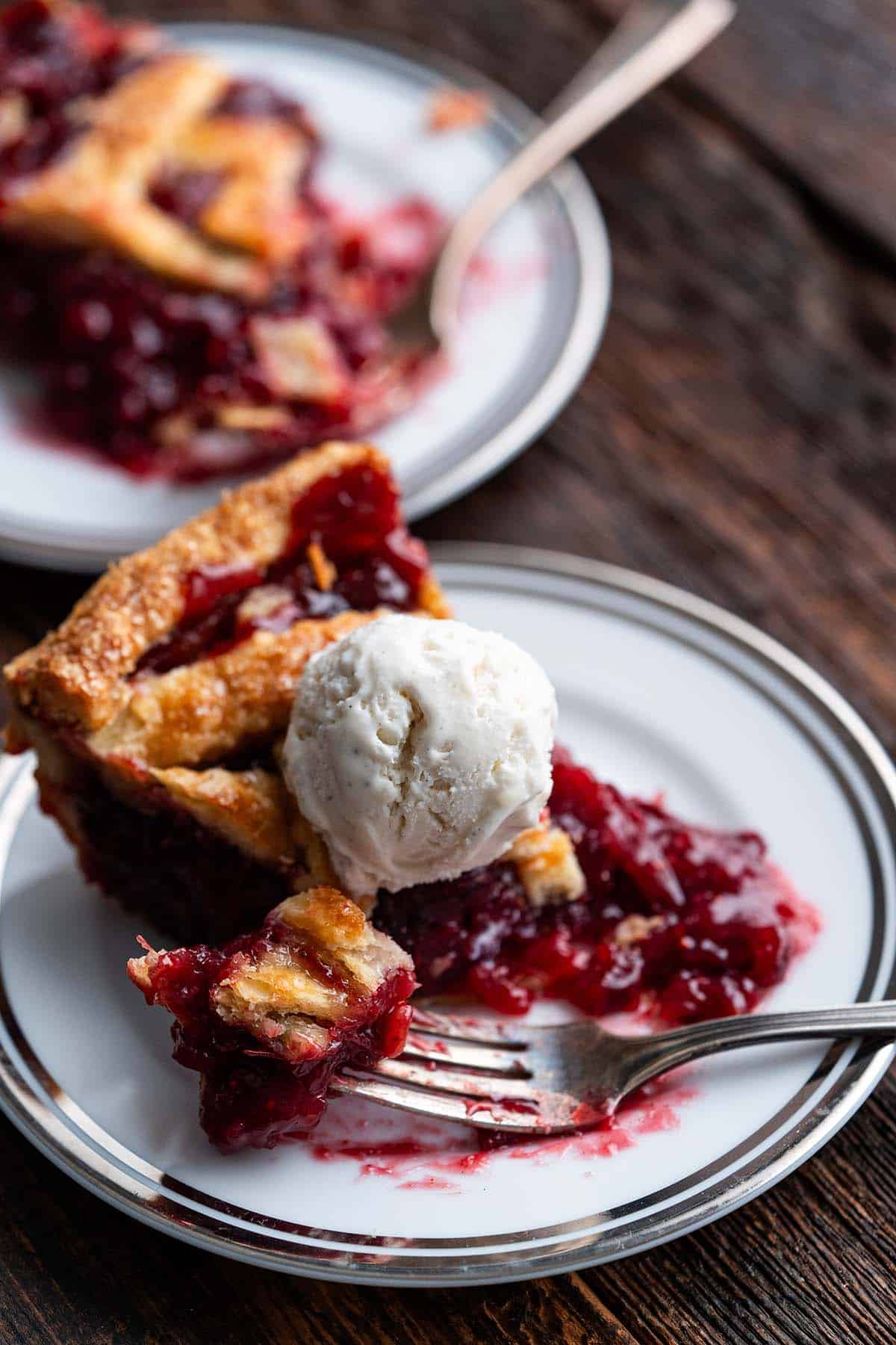 Cranberry Pie Recipe Try A New Festive Pie For The Holidays An   2 Slices Of Fresh Cranberry Pie On Plates Partially Eaten 